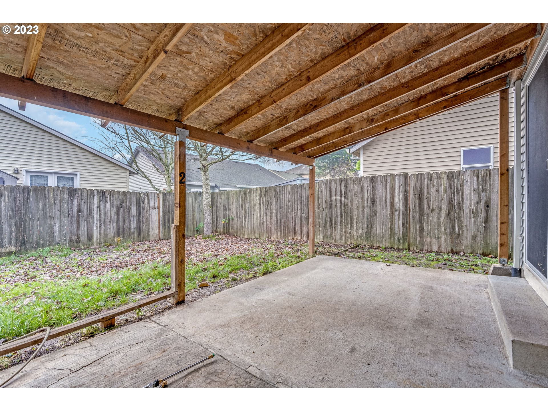 713 Northeast Mariners Loop Portland, OR 97211 - Photo 34 of 40 a backyard of a house with wooden fence
