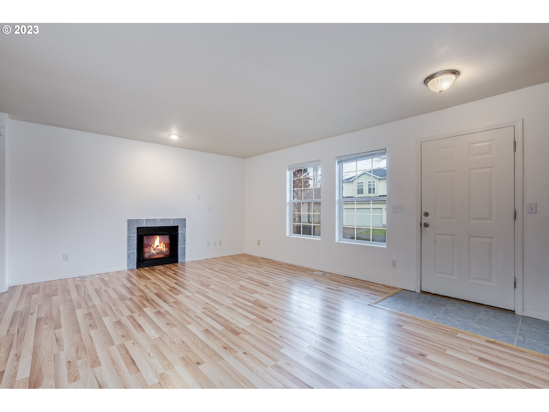 713 Northeast Mariners Loop Portland, OR 97211 - Photo 7 of 40 wooden floor in an empty room with a window