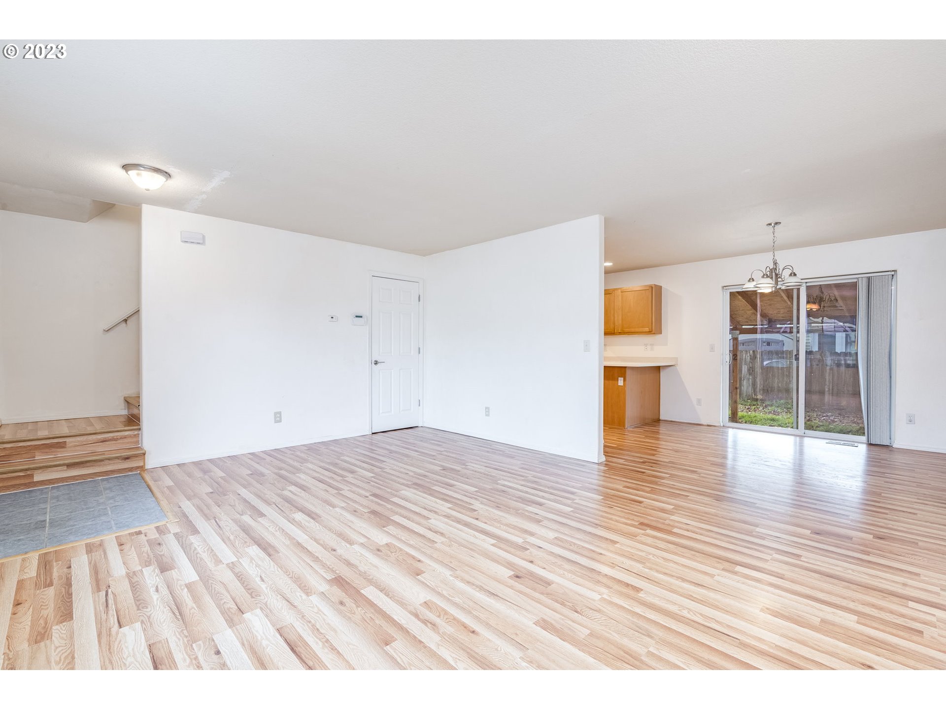 713 Northeast Mariners Loop Portland, OR 97211 - Photo 9 of 40 a view of empty room with wooden floor and windows