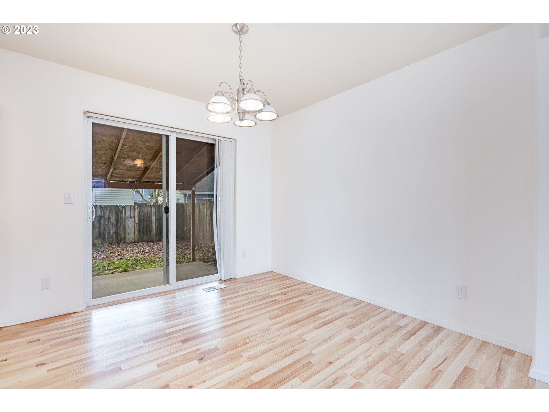 713 Northeast Mariners Loop Portland, OR 97211 - Photo 10 of 40 wooden floor in an empty room with a window