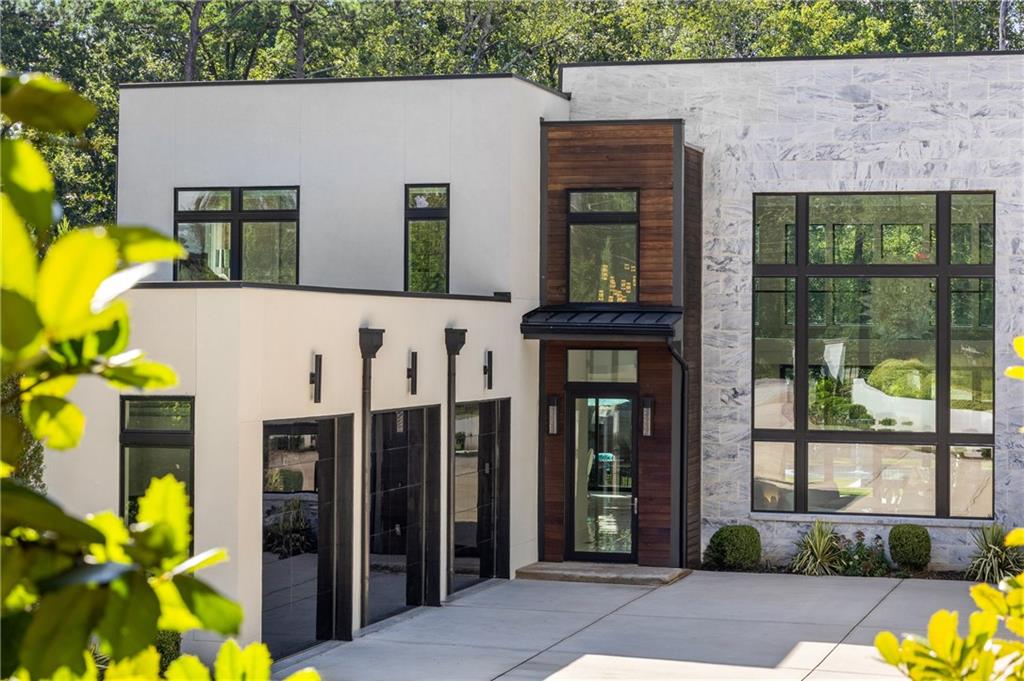 1105 Moores Mill Road Northwest Atlanta, GA 30327 - Photo 12 of 77 a view of a house with potted plants