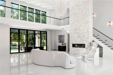 a large kitchen with a table and chairs