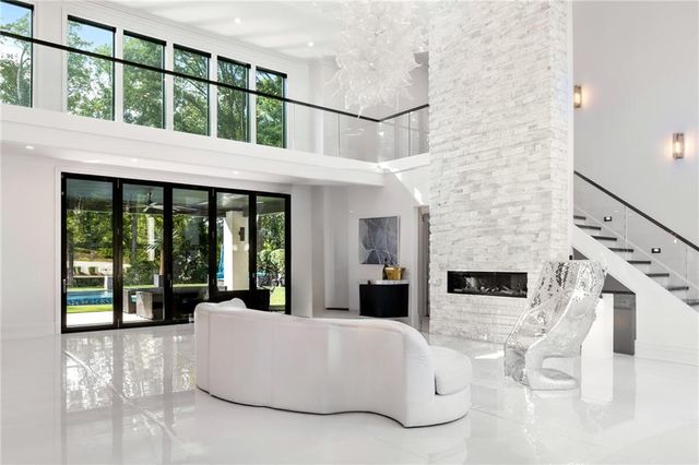 a large kitchen with a table and chairs