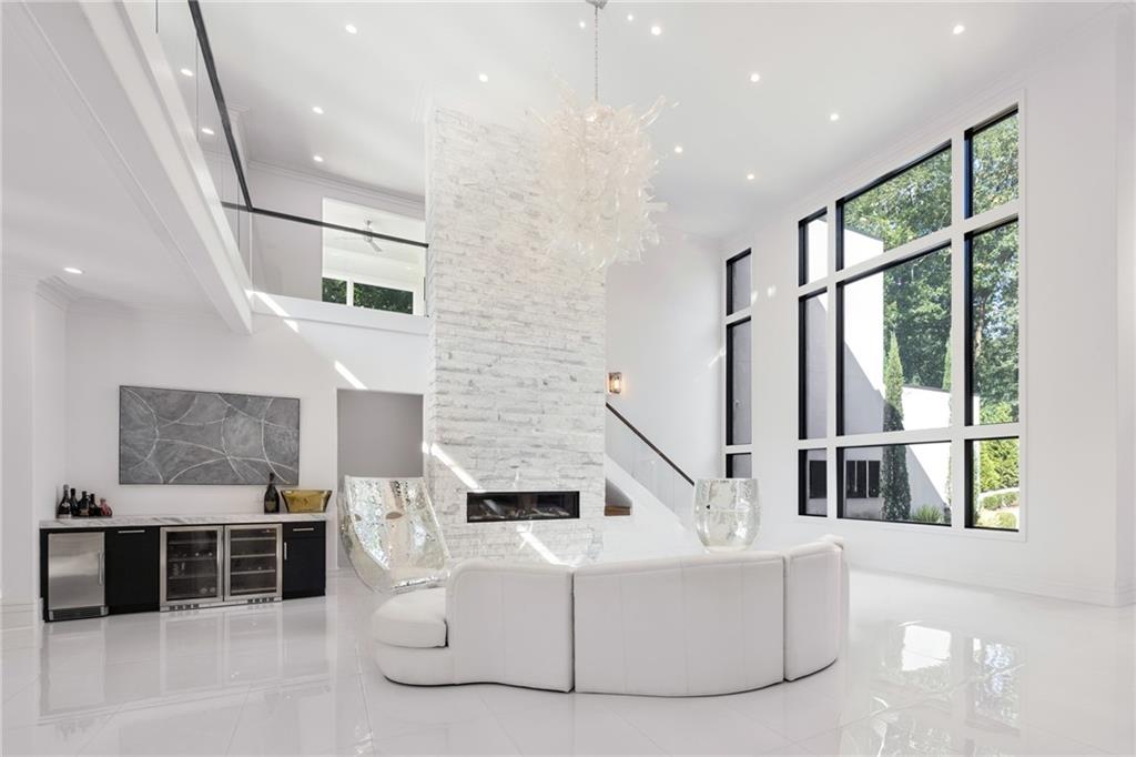 1105 Moores Mill Road Northwest Atlanta, GA 30327 - Photo 19 of 77 a living room with furniture windows and a flat screen tv