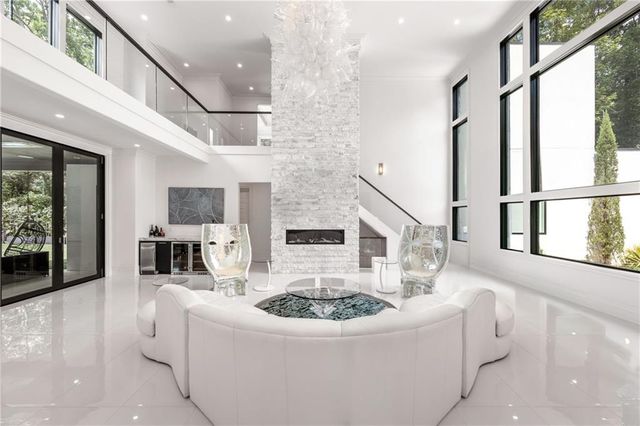 a bathroom with a sink a toilet and a window