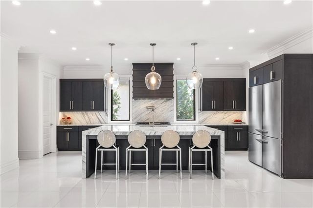 a view of a dining room with furniture and chandelier