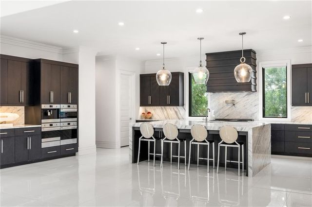 a spacious bedroom with a bed and dresser