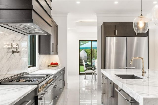 a bathroom with a sink toilet and a mirror