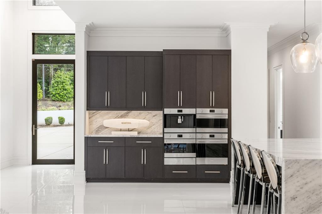 1105 Moores Mill Road Northwest Atlanta, GA 30327 - Photo 28 of 77 a kitchen with stainless steel appliances granite countertop a stove and a refrigerator