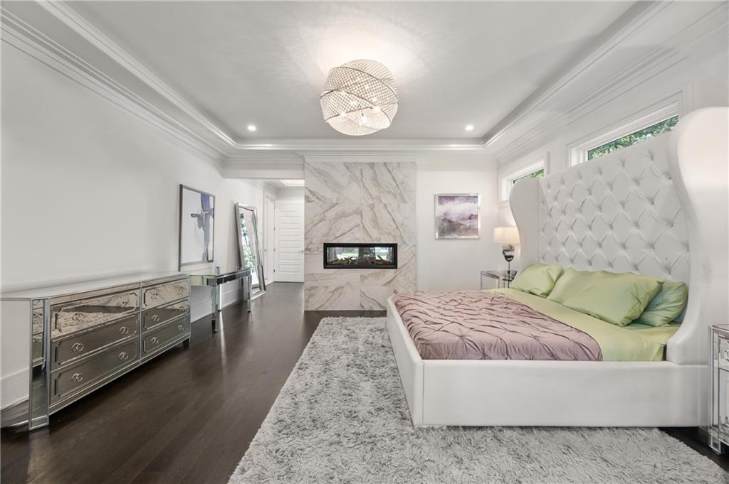 1105 Moores Mill Road Northwest Atlanta, GA 30327 - Photo 36 of 77 a living room with furniture and a table