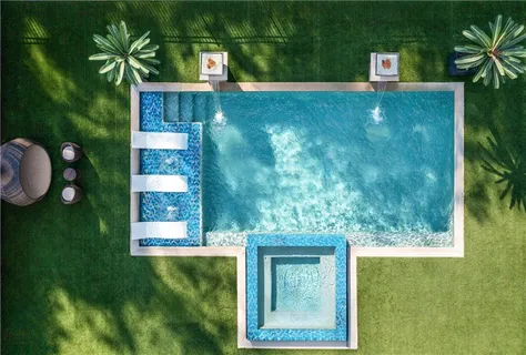 a view of a swimming pool with an outdoor kitchen
