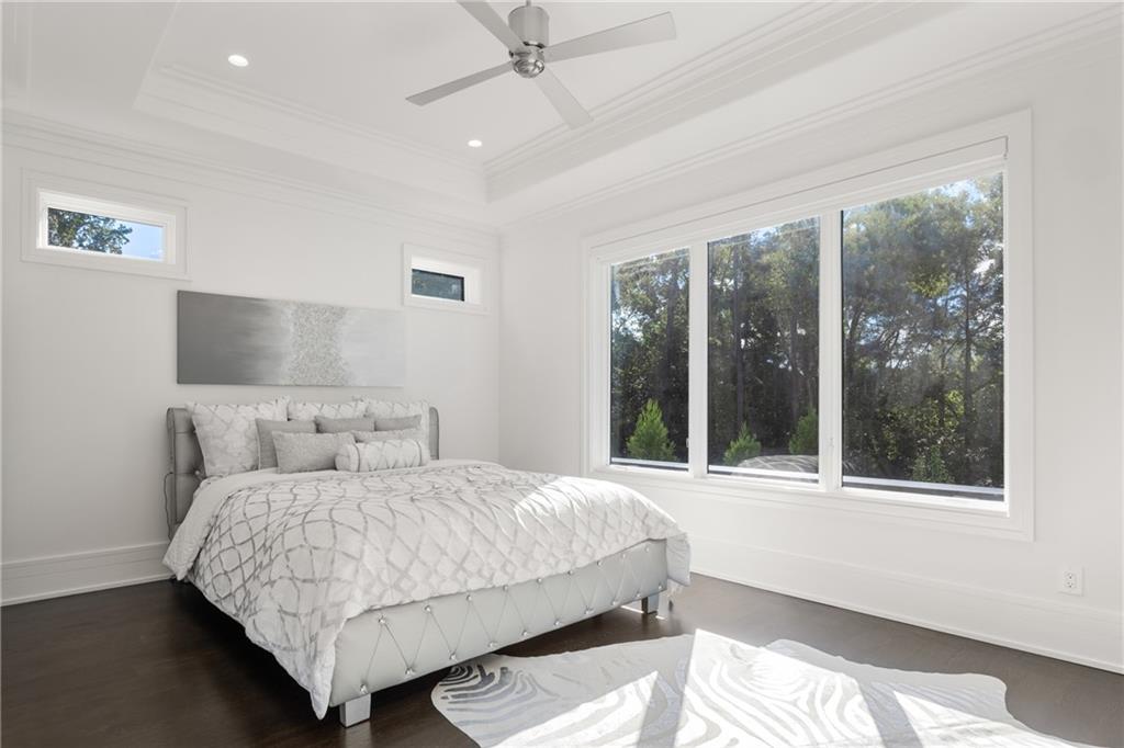 1105 Moores Mill Road Northwest Atlanta, GA 30327 - Photo 45 of 77 a bedroom with a bed and a large window