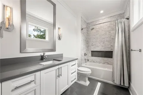 a view of a house with swimming pool and sitting area