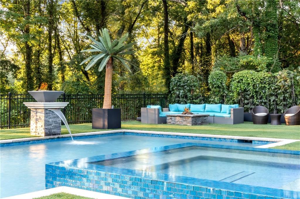 1105 Moores Mill Road Northwest Atlanta, GA 30327 - Photo 69 of 77 a view of a swimming pool with a garden