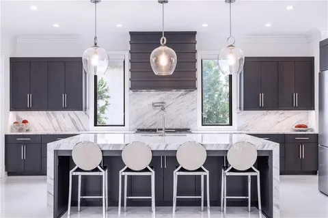 a view of a house with potted plants