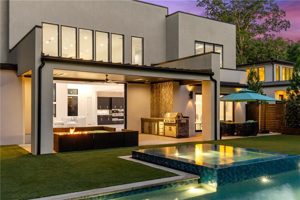 1105 Moores Mill Road Northwest Atlanta, GA 30327 - Photo 74 of 77 a view of a house with swimming pool and sitting area