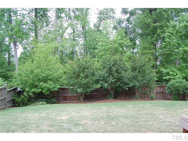 5422 Regatta Way Raleigh, NC 27613 - Photo 14 of 18 a backyard of a house with lots of green space