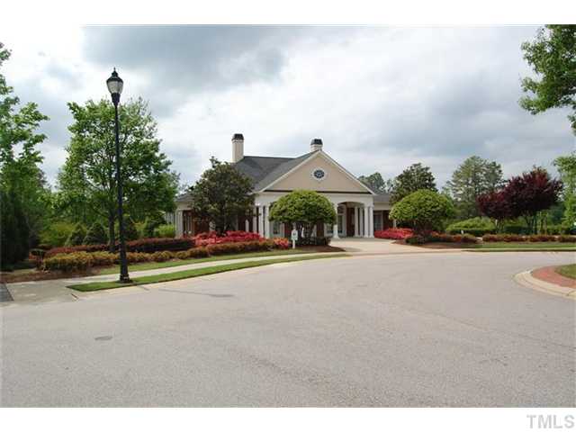 5422 Regatta Way Raleigh, NC 27613 - Photo 17 of 18 a view of a street with houses on both side of it
