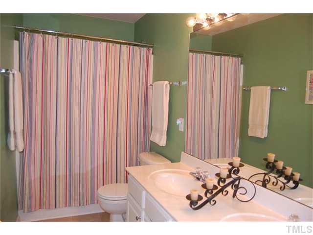 5422 Regatta Way Raleigh, NC 27613 - Photo 10 of 18 a bathroom with a sink toilet and shower