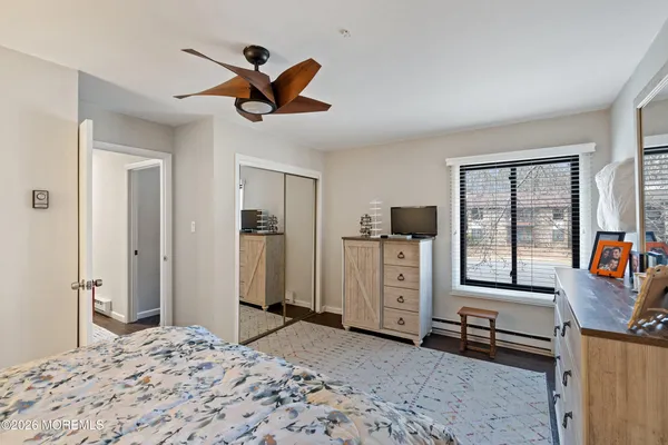 a bedroom with furniture and window