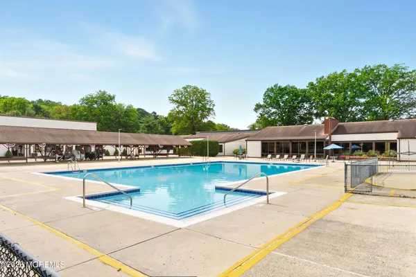 a view of a swimming pool with lounge chair