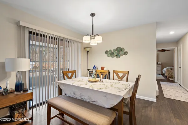 a dining room with furniture and window