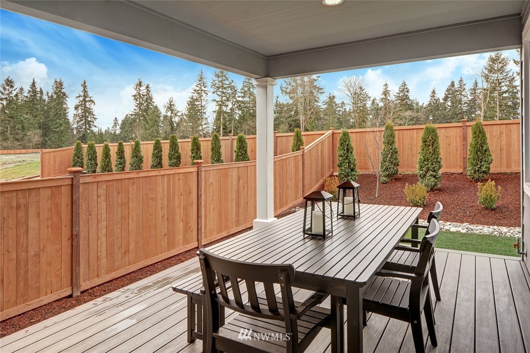 304 Field Place Southeast Renton, WA 98059 - Photo 10 of 10 a view of a patio with a table chairs and wooden floor
