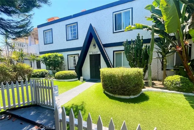 a view of a two chairs in the patio