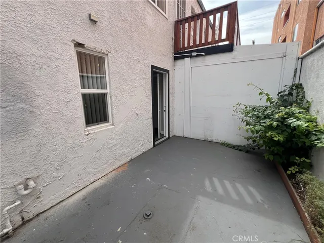 a view of closet with wooden floor