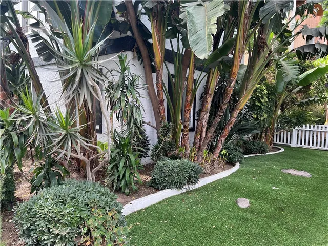 a view of a house with a wall