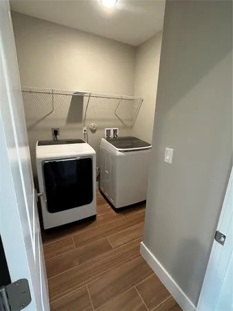 a view of entryway with stairs and wooden floor