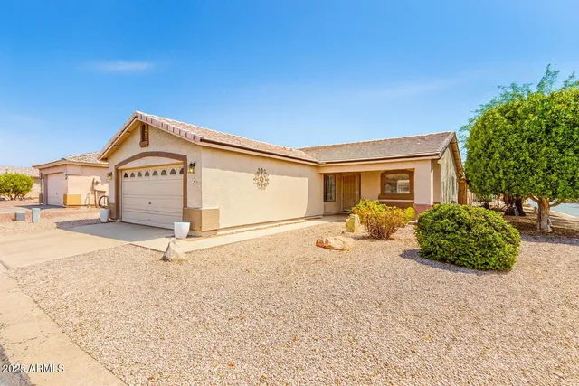 a view of a house with a snow in the yard