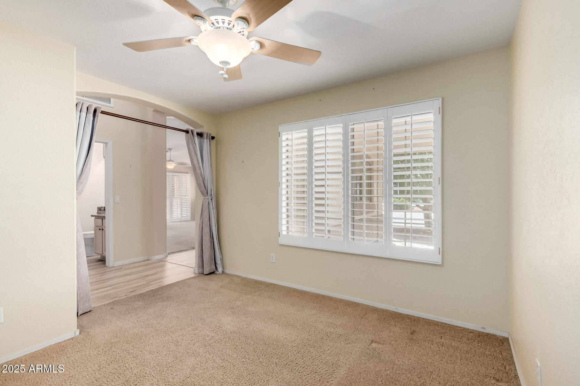 2101 South Meridian Road, Unit 301 Apache Junction, AZ 85120 - Photo 12 of 30 a view of an empty room with a window