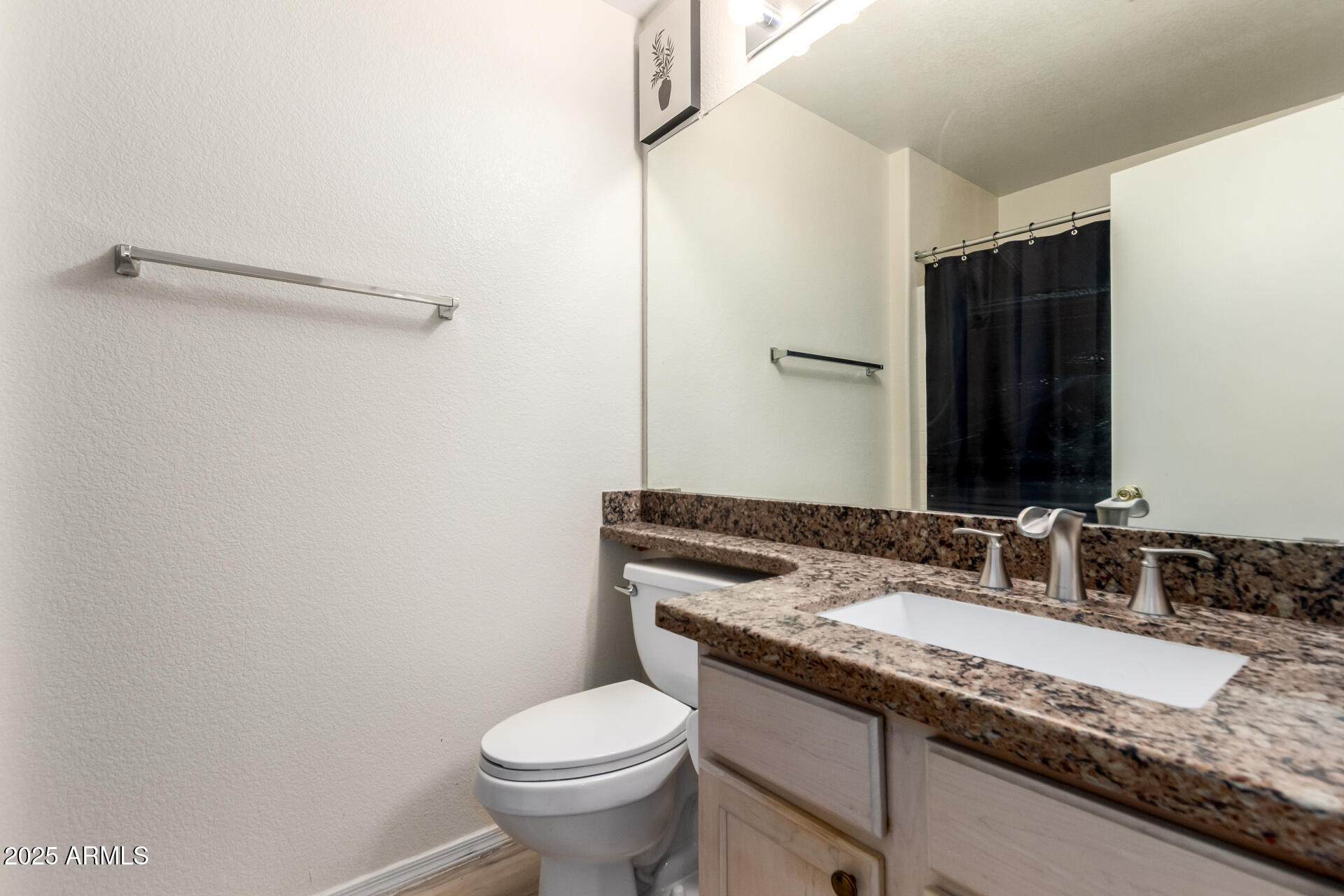 2101 South Meridian Road, Unit 301 Apache Junction, AZ 85120 - Photo 14 of 30 a bathroom with a granite countertop sink toilet and mirror