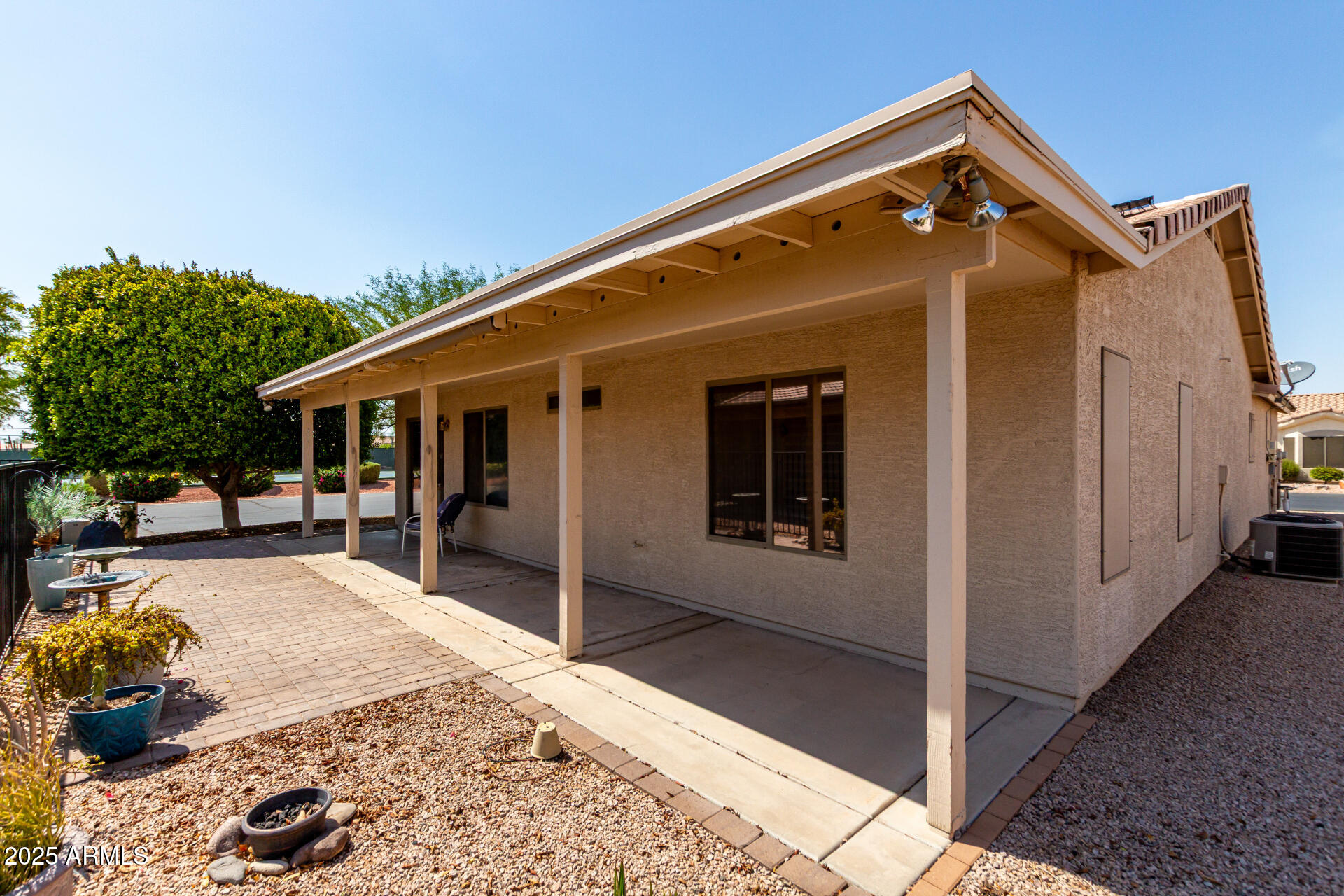 2101 South Meridian Road, Unit 301 Apache Junction, AZ 85120 - Photo 19 of 30 a view of house with backyard and seating space