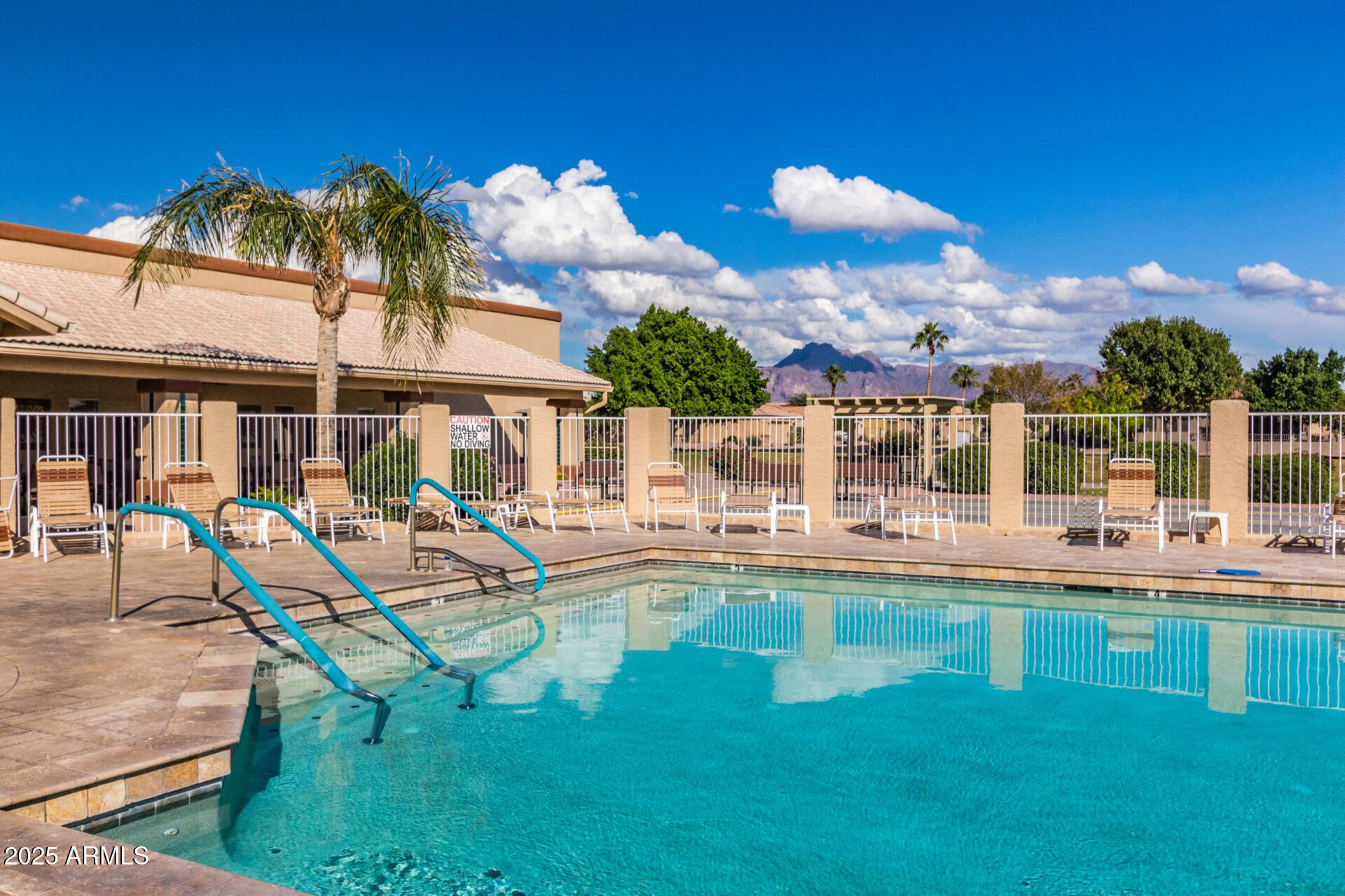 2101 South Meridian Road, Unit 301 Apache Junction, AZ 85120 - Photo 22 of 30 a view of a house with a swimming pool