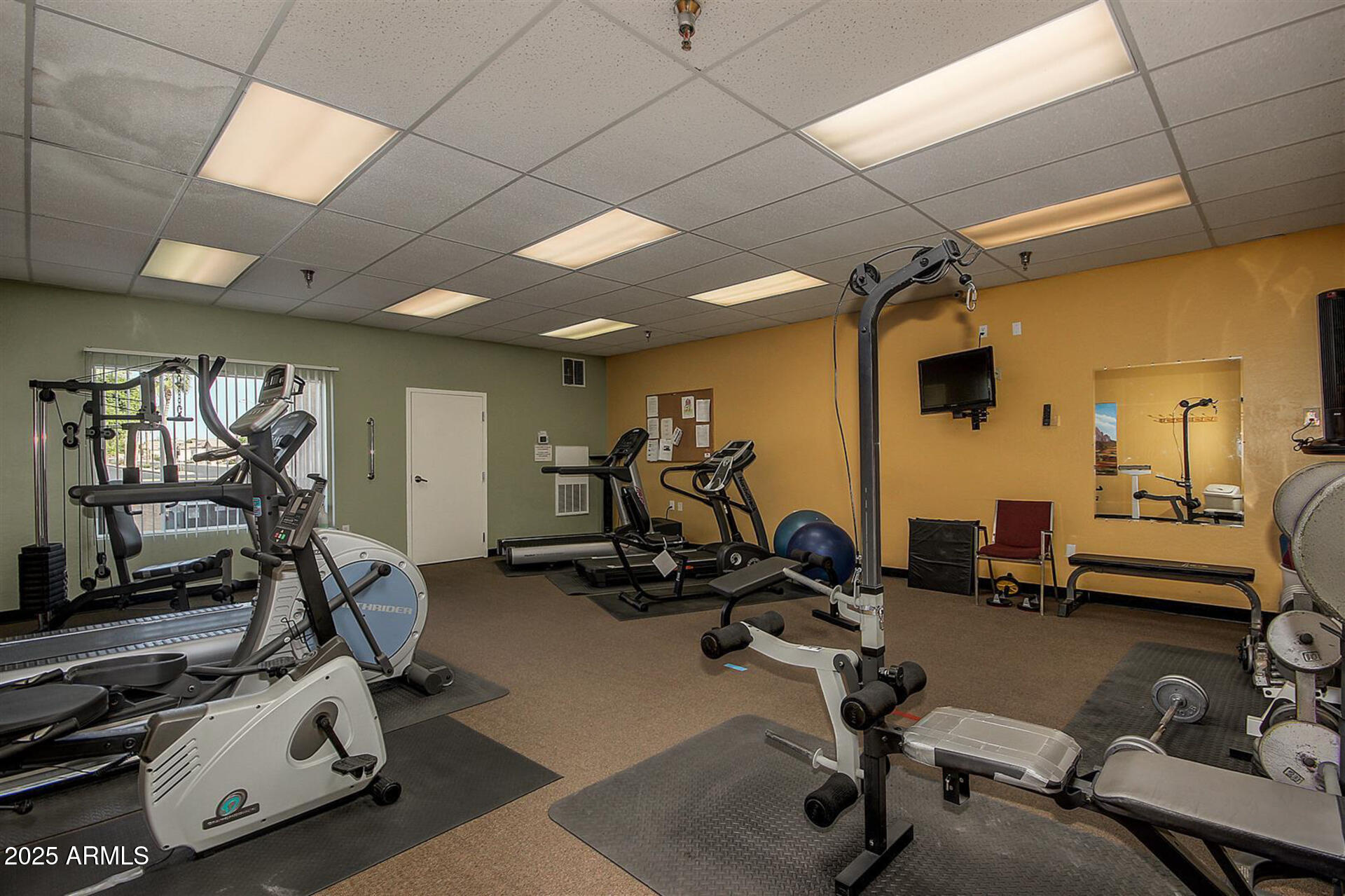 2101 South Meridian Road, Unit 301 Apache Junction, AZ 85120 - Photo 26 of 30 a view of a room with gym equipment