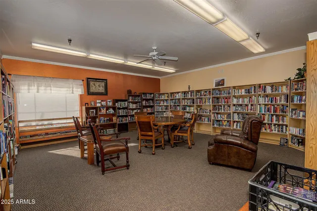 a kitchen with a table chairs and white appliances