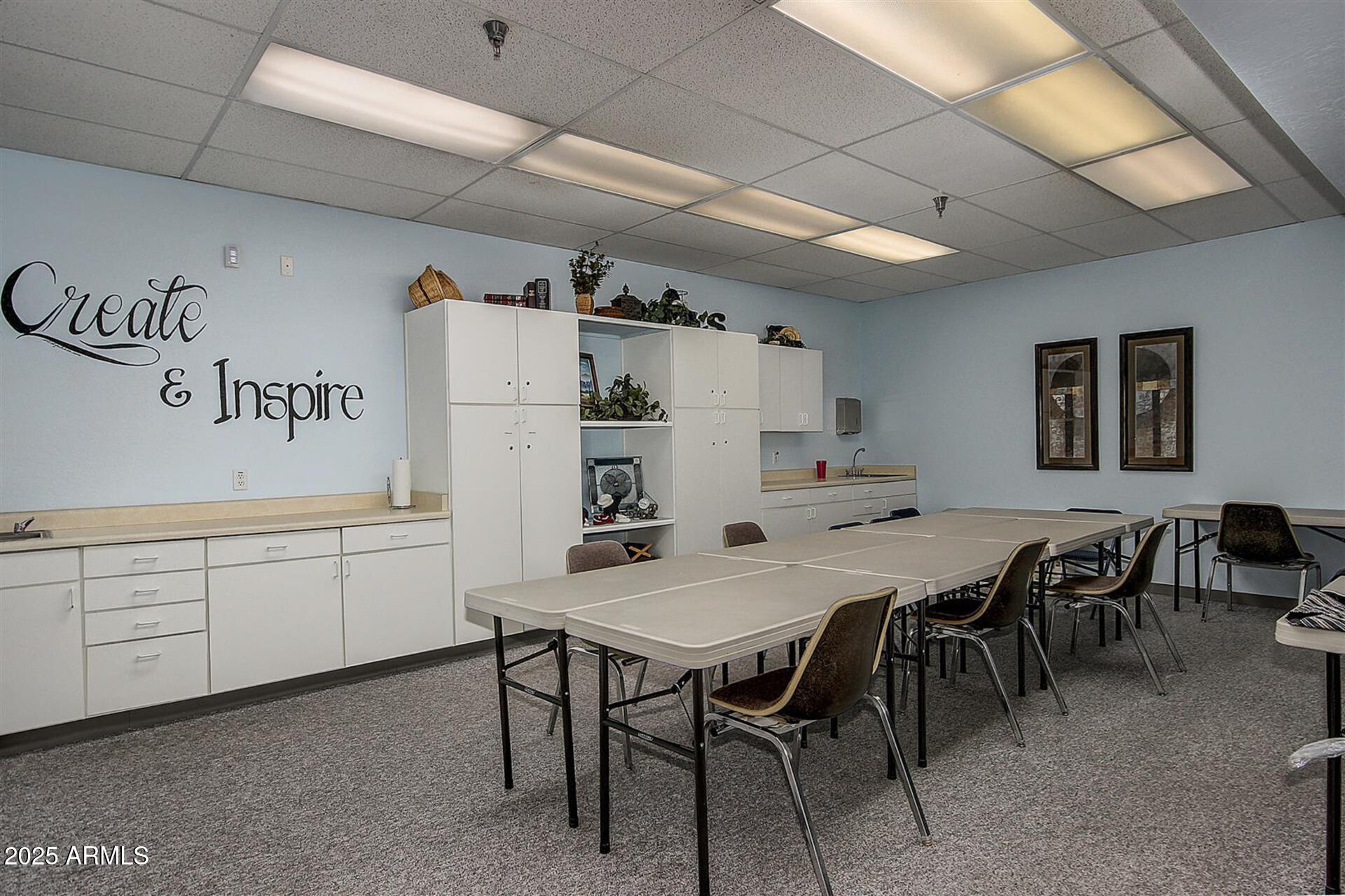 2101 South Meridian Road, Unit 301 Apache Junction, AZ 85120 - Photo 29 of 30 a kitchen with a table chairs and white appliances