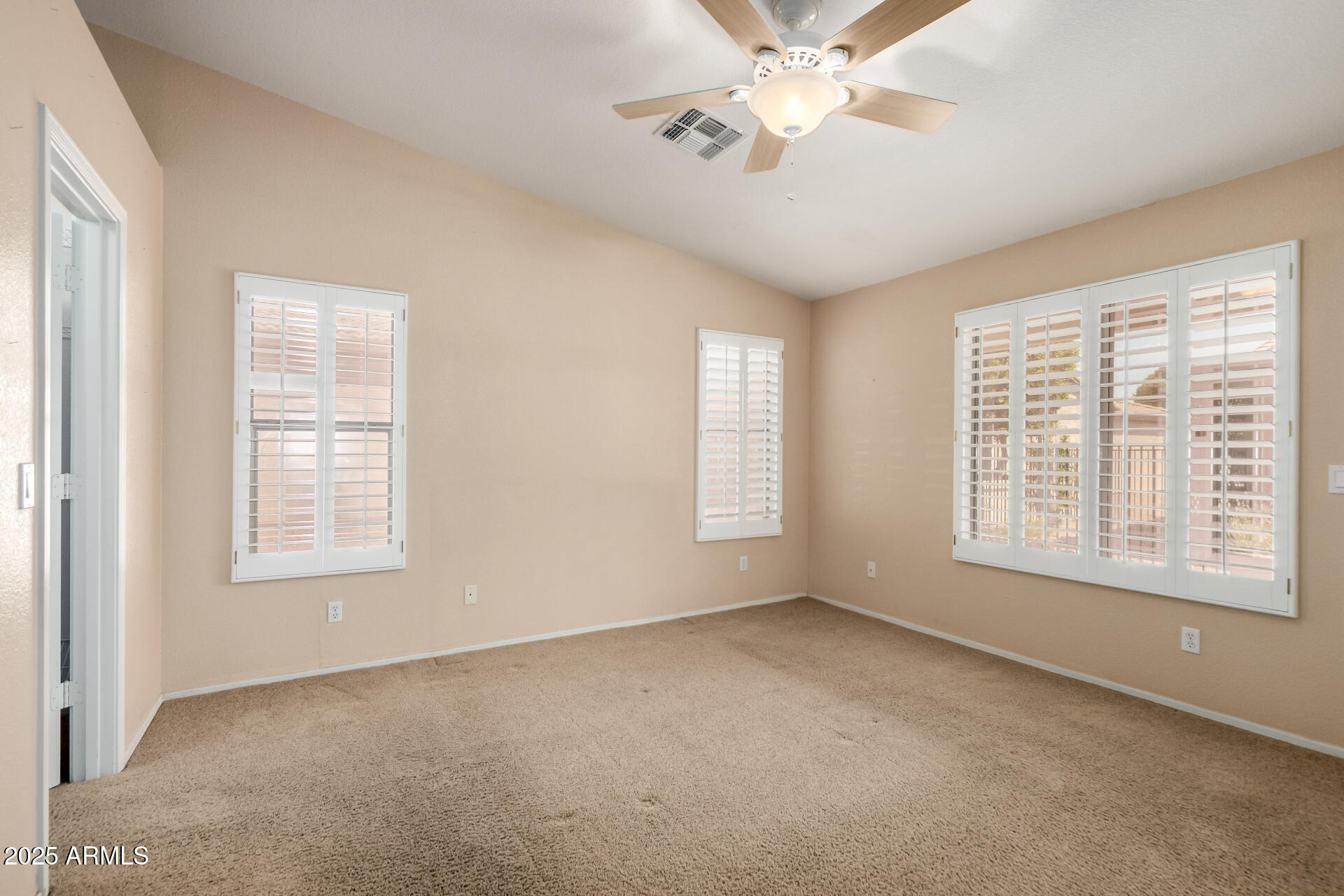 2101 South Meridian Road, Unit 301 Apache Junction, AZ 85120 - Photo 9 of 30 a view of an empty room with a window