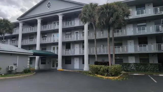 a front view of a building with many windows