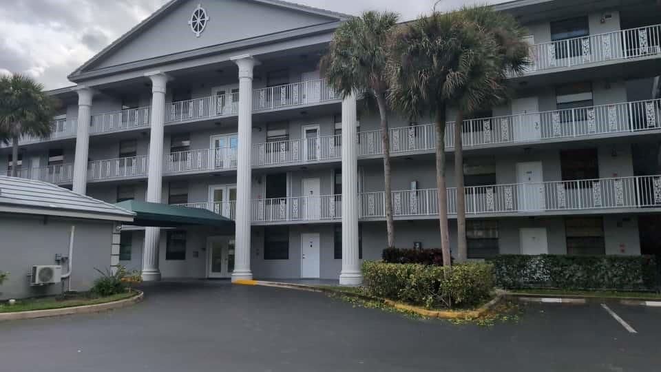 a front view of a building with many windows