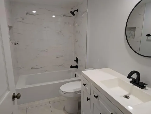 a bathroom with a sink a toilet and a bathtub