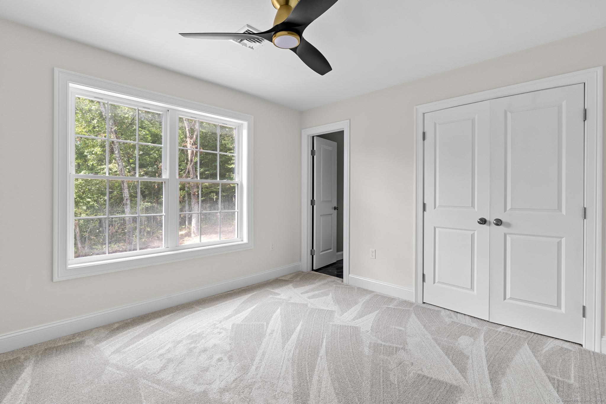289 Young Street East Hampton, CT 06424 - Photo 12 of 15 a view of an empty room with a window