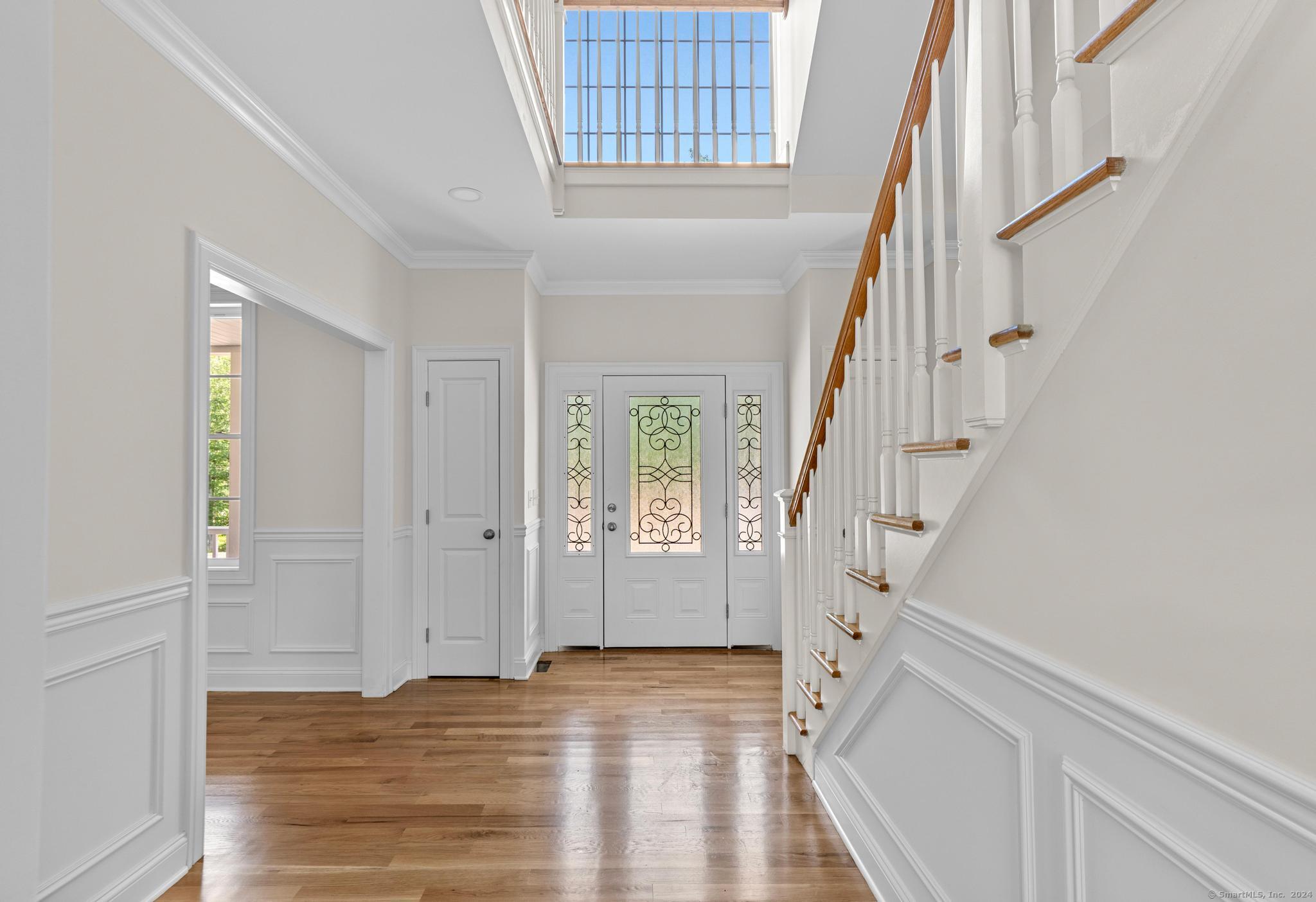 289 Young Street East Hampton, CT 06424 - Photo 15 of 15 a view of entryway with wooden floor and front door