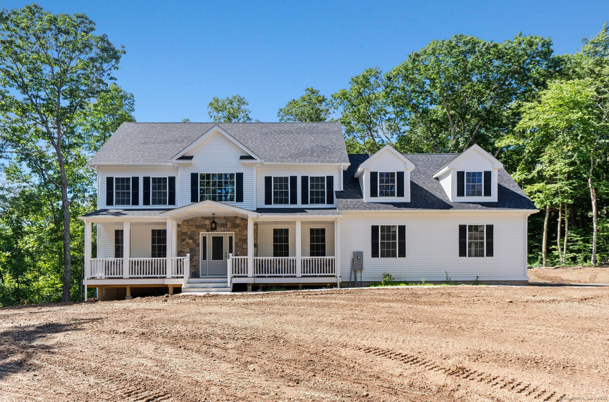 289 Young Street East Hampton, CT 06424 - Photo 2 of 15 a front view of a house with a yard
