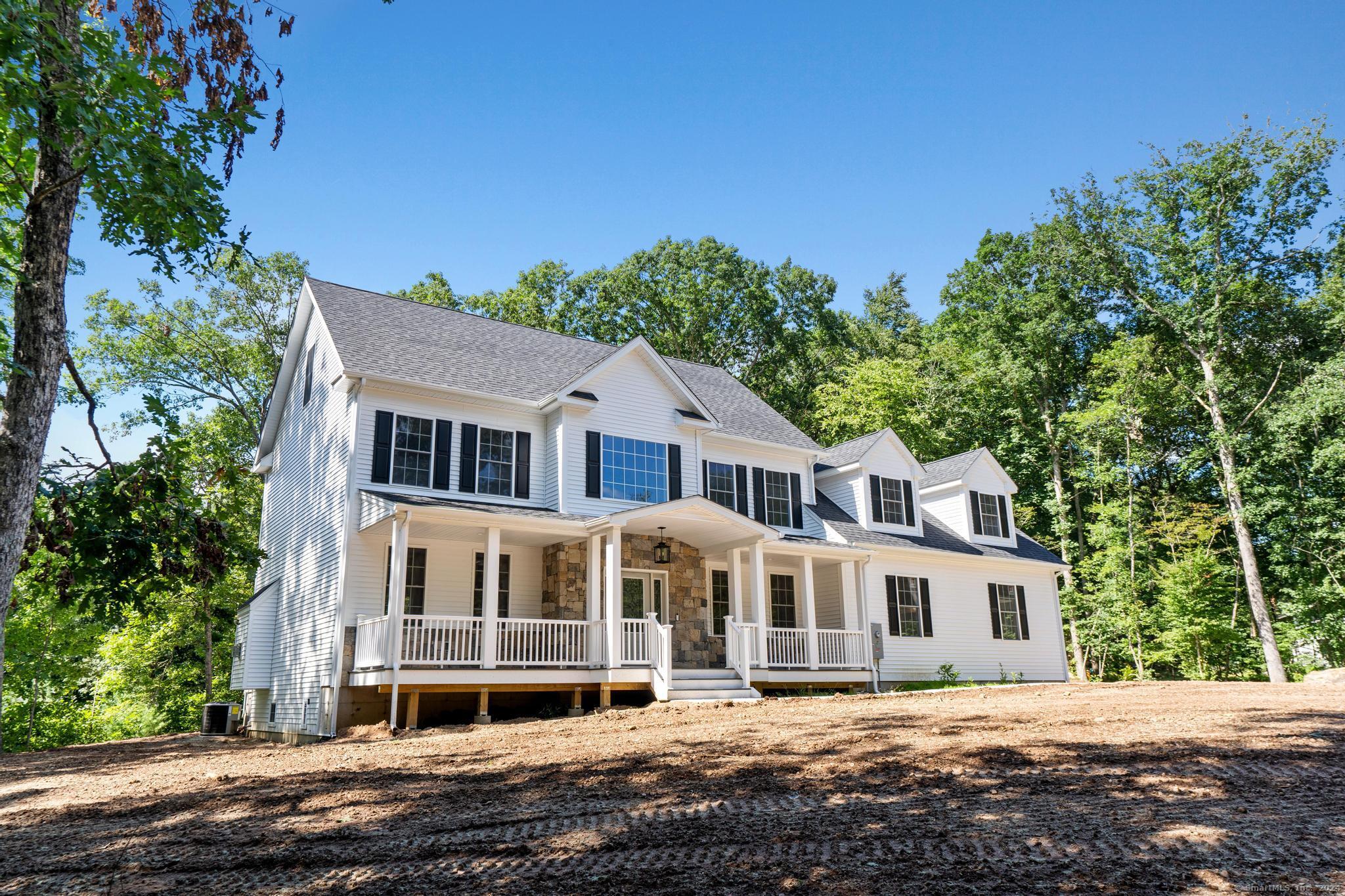289 Young Street East Hampton, CT 06424 - Photo 3 of 15 a front view of a house with a garden