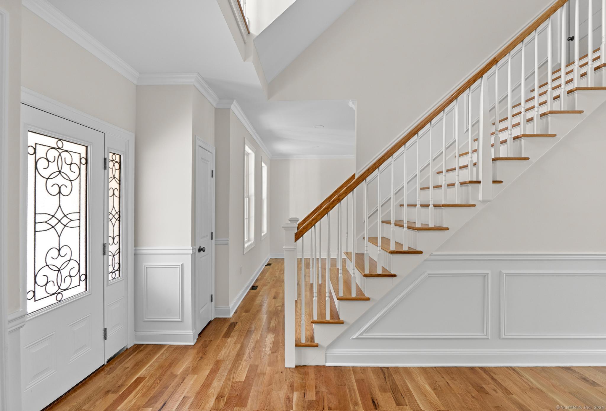 289 Young Street East Hampton, CT 06424 - Photo 6 of 15 a view of entryway with wooden floor and stairs