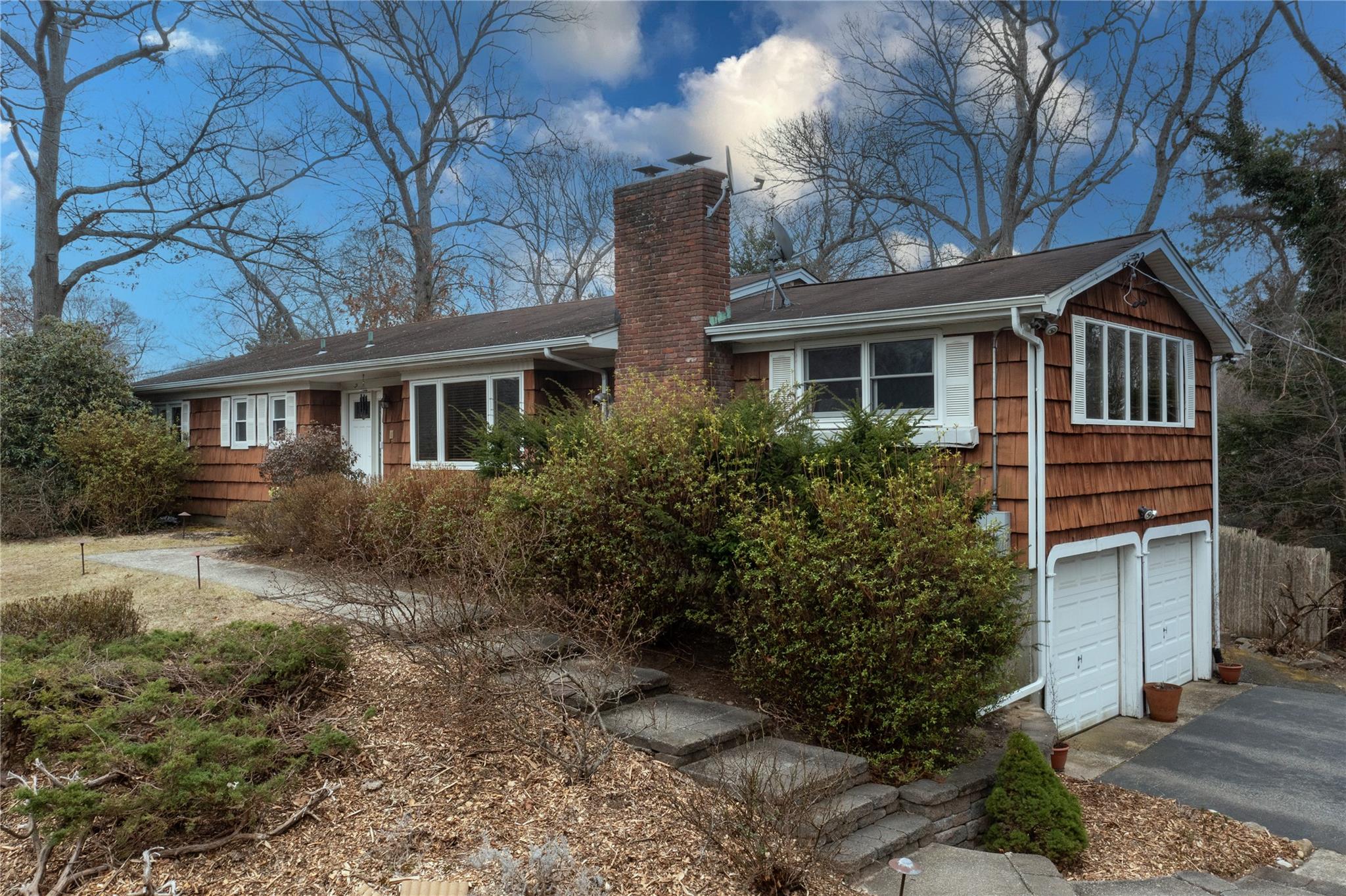 2 Andrea Drive East Setauket, NY 11733 - Photo 1 of 43 a front view of house with yard and trees