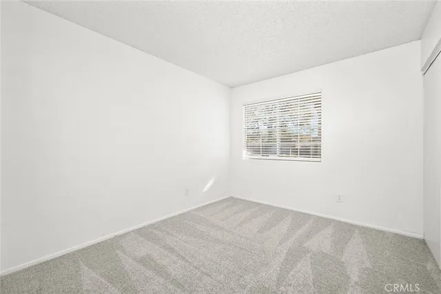 a view of an empty room with wooden walls